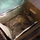 What remains of the time capsule that was opened this week in Louisville (Screenshot from the Courier Journal)